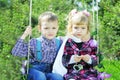 Couple in love little children on green meadow Royalty Free Stock Photo