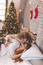 Couple waking up together on Christmas morning Royalty Free Stock Photo