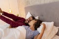 Couple waking up in bed Royalty Free Stock Photo