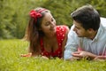 Couple in love lying on the grass in the park Royalty Free Stock Photo