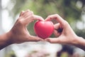 Couple in love making heart symbol shape with finger and hands togetherness. Valentines day concept. Romantic travel trip and Royalty Free Stock Photo