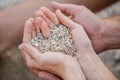 Couple in love, male and female Hands holding a sand in form of the heart Royalty Free Stock Photo