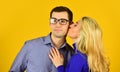 Couple in love. man and woman embrace. smart looking guy wear glasses. sexy bonde girl kiss and hug her boyfriend. happy