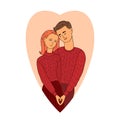 Couple in love. Man and woman hugging each other making a heart shape. Wife and husband wearing knitted sweaters