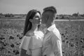 couple in love. man and woman in poppy field. summer flower meadow. Royalty Free Stock Photo