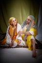 A couple in love or a married couple in stylized Eastern clothing from Israel, Palestine, Iran, Pakistan together. A