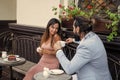 couple in love of man and woman meet in cafe outdoor drink coffee, first meet Royalty Free Stock Photo