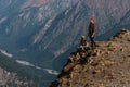 Couple in love in the mountains at sunset. Tourists on the tour. Couple in the Caucasus mountains, Russia. Man and woman at sunset Royalty Free Stock Photo