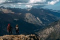 Couple in love in the mountains at sunset. Tourists on the tour. Couple in the Caucasus mountains, Russia. Royalty Free Stock Photo