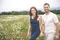 Couple in love outdoor at the sunset daisy