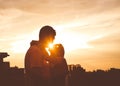 couple love passion hugs outside sunset kiss