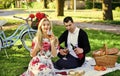 Couple in love picnic date. Spring weekend. First Date Ideas Guaranteed to Win Her Heart. Enjoying their perfect date Royalty Free Stock Photo