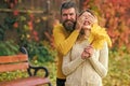 Couple in love play in autumn park. Love relationship and romance. Autumn happy couple of girl and man outdoor. Nature Royalty Free Stock Photo