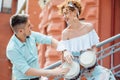 Couple in love playing on the drum on the street Royalty Free Stock Photo
