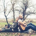 Couple in love playing serenade with guitar Royalty Free Stock Photo