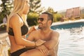 Couple having fun at a swimming pool Royalty Free Stock Photo