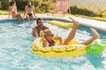 Couple having fun at a poolside party Royalty Free Stock Photo