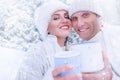 Couple in love portrait in snow forest