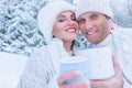 Couple in love portrait in snow forest
