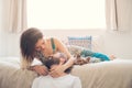 Couple in love with puppy laughing in their room Royalty Free Stock Photo