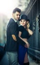Couple in love in railway station. Beautiful well-dressed couple standing on railway platform Royalty Free Stock Photo