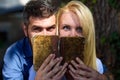 Couple in love read ancient book, dark background.