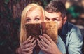 Couple in love read ancient book, dark background.