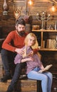 Couple in love reading poetry in warm atmosphere. Romantic evening concept. Lady and man with beard on dreamy faces hugs