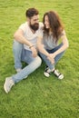 Couple in love relaxing on green lawn. Lovely couple outdoors. Soulmates closest people. Simple happiness. Couple