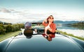 Couple in love ride in cabriolet on the picturesque mountain road Royalty Free Stock Photo