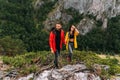 A couple in love on a rock admires the beautiful views. A man and a woman on a rock. A couple in love travels. Royalty Free Stock Photo