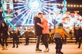 Couple in Love. Romantic Characters for Feast of Saint Valentine. True love. Happy Couple Having Fun at city ice rink in Royalty Free Stock Photo