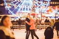 Couple in Love. Romantic Characters for Feast of Saint Valentine. True love. Happy Couple Having Fun at city ice rink in Royalty Free Stock Photo