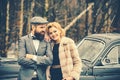 Couple in love on romantic date. Escort of girl by security. Retro collection car and auto repair by mechanic driver Royalty Free Stock Photo