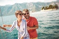 Couple on a sail boat in the summer. Royalty Free Stock Photo