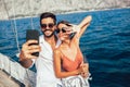 Couple on a sail boat in the summer make selfie Royalty Free Stock Photo