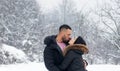 Couple in love, sensual lovers kissing and embracing in winter outdoor. Royalty Free Stock Photo