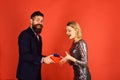 Couple in love shares presents on red background Royalty Free Stock Photo