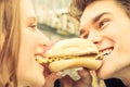 Couple in Love sharing an Hot Dog Royalty Free Stock Photo