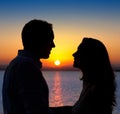 Couple in love silhouette at lake sunset Royalty Free Stock Photo