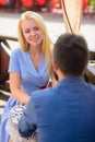 Couple in love sit at terrace, cafe outdoor, urban background, Royalty Free Stock Photo