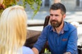 Couple in love sit at terrace, cafe outdoor, urban background, Royalty Free Stock Photo