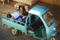 Couple in love sitting in the back of a mini truck Royalty Free Stock Photo