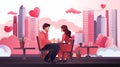 couple in love sitting at cafe table happy valentines day celebration concept cityscape background full length Royalty Free Stock Photo