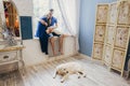 Couple in love sitting at home on the window. Tender loving embrace of newlyweds. Fun morning happy mood of a loving couple. Girl Royalty Free Stock Photo