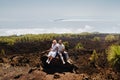 A couple in love is sitting on the slope of the Teide volcano. Desert landscape in Tenerife. Teide National Park Royalty Free Stock Photo