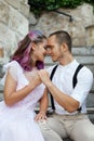 Couple in love is sitting on the stairs and embracing. Love and relationships between men and women. Royalty Free Stock Photo