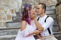 Couple in love is sitting on the stairs and embracing. Love and relationships between men and women Royalty Free Stock Photo