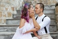 Couple in love is sitting on the stairs and embracing. Love and relationships between men and women. Royalty Free Stock Photo