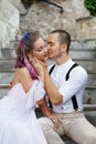 Couple in love is sitting on the stairs and embracing. Love and relationships between men and women Royalty Free Stock Photo